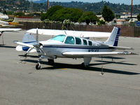 N2141L @ KSQL - 1976 Beech A36 parked on transient ramp - by Steve Nation