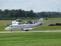 N716QS @ KSBM - Landing at KSBM past the 
mobile FAA control tower - by steveowen