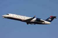 N404AW @ ORF - US Airways Express (Air Wisconsin) N404AW climbing out from RWY 5 en route to Reagan National (KDCA) as Flight AWI3872. - by Dean Heald