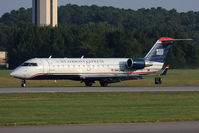 N412AW @ ORF - US Airways Express (Air Wisconsin) N412AW rolling out on RWY 5 after arrival from Philadelphia Int'l (KPHL) as Flight AWI3581. - by Dean Heald