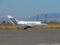 N831LX @ KAPC - Napa River RR bridge provides background for Flight Options Hawker 800XP (OPT831) taxiing for take-off to KPDX/Portland International Airport, OR - by Steve Nation