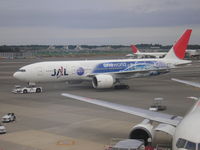 JA704J @ NRT - One World cs. Plane just arrived from Amsterdam - by Henk Geerlings