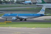 PH-EZP @ EHAM - KLM cityhopper taxiing for take off with a Jade Cargo B747 rolling behind - by Robert Kearney