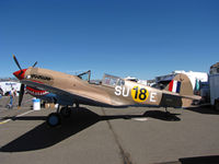N94466 @ KRTS - Race #18 is a sharkmouth P-40E (as NX94466) with desert camo and SU-E code for Unlimited Class races in pit area @ 2009 Reno Air Races - by Steve Nation