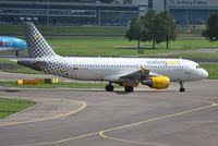 EC-KDH @ EHAM - Vueling turning out onto the outer t/w for departure - by Robert Kearney