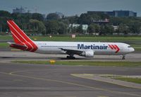 PH-MCI @ EHAM - Martinair taxiing for departure - by Robert Kearney