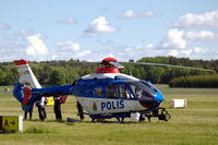 SE-HPX @ ESOW - A police EC135 parked in the grass at Västerås Hässlö airport, Sweden. - by Henk van Capelle