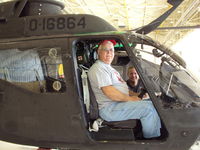 68-16864 @ ALO - 41 years later, I can still get my butt into the cockpit!  CW3 Eric Schuler of the Iowa National Guard looks on.  Eric was our host for this mini-reunion.  I live in Newton, IA. - by Bookie