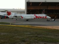 C-GKEJ @ CYYC - Air Canada Jazz jet getting ready for engine testing.  Never seen this type of tow truck/dolly/whatever before.  The guys are almost lying down on the job. - by awparran