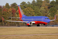 N627SW @ ORF - Southwest Airlines N627SW (FLT SWA889) starting takeoff roll on RWY 23 en route to Jacksonville Int'l (KJAX) with nice autumn colors in the trees in the background. - by Dean Heald