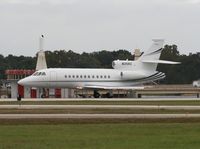 N35RZ @ ORL - Falcon 900 with a bald eagle sitting on the VOR