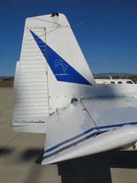 N4390K @ KCMA - CLOSE-UP OF TAIL: 2 dolphins and CVF Productions on 1948 Ryan Navion on sunny, balmy home ramp at Camarillo Airport in early Jan 2007 - by Steve Nation