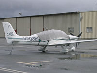 N803EM @ KSQL - 2003 Cirrus Design SR22 buttoned up for rain @ San Carlos, CA home base (sold to owner in Iowa in May 2007) - by Steve Nation