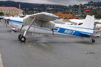 N817 @ KSQL - Cessna 180K on San Carlos, CA visitors ramp on very windy day with rain in the forecast - by Steve Nation