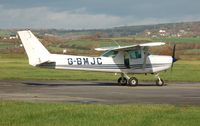 G-BMJC @ EGFP - Resident Cessna 152 - by Roger Winser