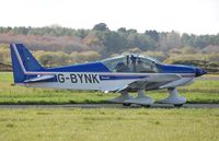 G-BYNK @ EGFP - Penguin Flight Group's HR200 visiting Pembrey Airport. - by Roger Winser