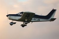 G-BCJM @ EGFH - Piper Cherokee departing at dusk for a local flight - by Roger Winser
