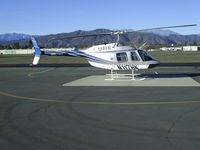 N117HK @ POC - Parked at west helipad and visiting the drag races at LACO Fairplex - by Helicopterfriend