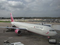 N845MH @ EGCC - Delta B-767 in Breast Cancer Awareness Colours at Manchester International UK.Taken from inside the terminal building - by steveowen