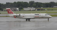 N8938A @ KMSP - Stormy day in MSP - by Todd Royer