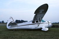 N88WT @ KDPA - Ex-N88WT, US Navy NH-1 29457.  Enroute to OSH, lost control landing RY15, left the rwy and hit culvert. Moved to the base of the tower with storm-damaged aircraft. - by Glenn E. Chatfield