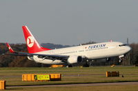 TC-JHB @ EGCC - Turkish Airlines B737 touching down on RW05L - by Chris Hall