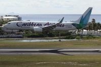 9Y-PBM @ TNCM - Caribbean airlines landing at TNCM with flashing a air jamaica logo!!! - by Daniel Jef