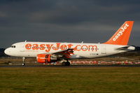 G-EZAC @ EGGW - easyJet A319 landing on RW26 - by Chris Hall