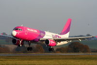 HA-LWB @ EGGW - Wizzair A320 landing on RW26 - by Chris Hall