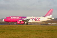 HA-LWB @ EGGW - Wizzair A320 landing on RW26 - by Chris Hall