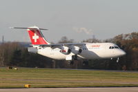 HB-IXO @ EGCC - Swiss European RJ100 landing on RW05L - by Chris Hall