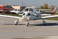 N2097N @ TDZ - Arriving at the EAA breakfast fly-in at Toledo, Ohio - by Bob Simmermon