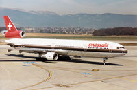 HB-IWM @ GVA - MD-11 of Swissair taxying to the terminal at Geneva in March 1993. - by Peter Nicholson