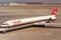 HB-INT @ GVA - MD-81 of Swissair taxying to the terminal at Geneva in March 1993. - by Peter Nicholson