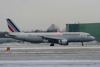 F-GKXZ @ EGCC - Air France A320 landing on RW05L - by Chris Hall