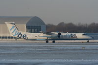 G-ECOB @ EGCC - flybe Dash-8 landing on RW05L - by Chris Hall