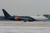 G-POWD @ EGCC - Titan Airways B767 landing on RW05L - by Chris Hall