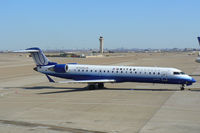 N756SK @ DFW - United Express pushing back from the gate at DFW Airport - by Zane Adams