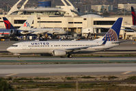 N87512 @ LAX - United Airlines N87512 (FLT COA17) holding short of RWY 25R on Taxiway Papa after arrival on RWY 25L from Newark Liberty Intl (KEWR). New United titles. - by Dean Heald