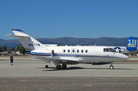 N427TM @ KWVI - Aircraft Holdings Raytheon Hawker 800XP at KWVI with TB-25N N125AZ #18 in background during 2010 Watsonville Fly-In - by Steve Nation