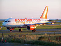 G-EZDP @ EGNS - Taxiing out in the evening light - by Manxman