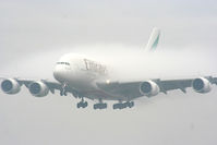 A6-EDF @ EGCC - Emirates A380 coming through the fog on approach to RW23R - by Chris Hall