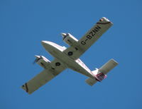 G-BZNN @ EGHH - Duchess in the overhead - by BIKE PILOT