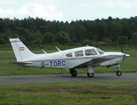 G-TORC @ EGHH - Arrow II taxying past the Flying Club - by BIKE PILOT
