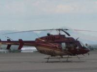 N619DE @ KTUS - Helicopter hovering over the helipad at base of the tower, KTUS - by Ehud Gavron