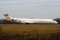 5A-LAD @ EGCC - Libyan Airlines CRJ-900 lining up on RW05L - by Chris Hall