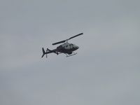 N587MG @ CNO - Heading southbound over the airport - by Helicopterfriend