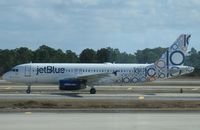 N569JB @ KMCO - jetBlue Airbus A320 taxiing after landing at MCO. - by Kreg Anderson