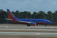 N424WN @ KMCO - Southwest Airlines Boeing 737-7H4 on takeoff roll. - by Kreg Anderson
