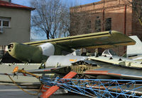 U9-10 @ LECU - A derelict C-127 lies among other aeronautical detritus in the scrapyard at el Museo del Aire, presumably donating parts in the restoration of two similar aircraft at the museum. - by Daniel L. Berek